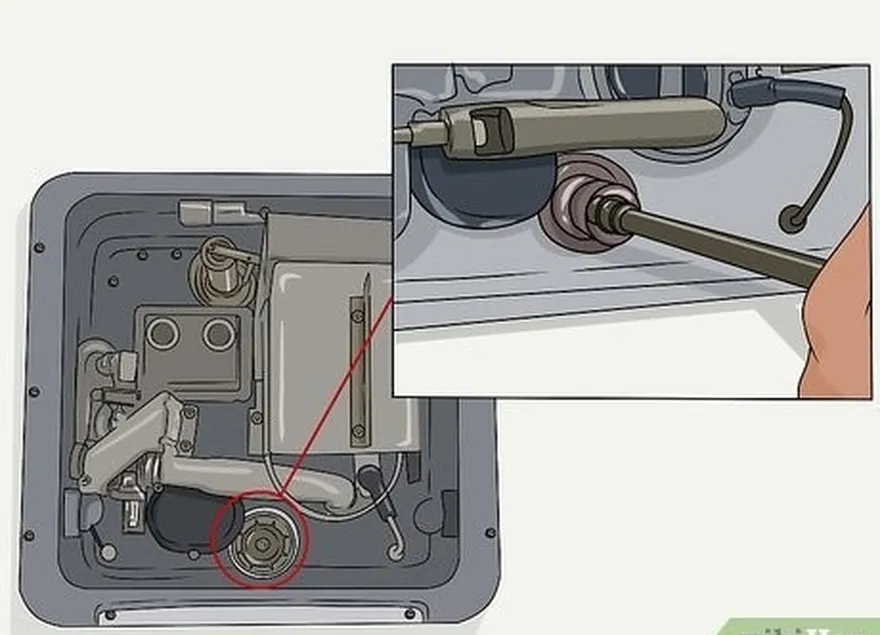 4-qadam tankni oching's plug or anode rod with a socket wrench.